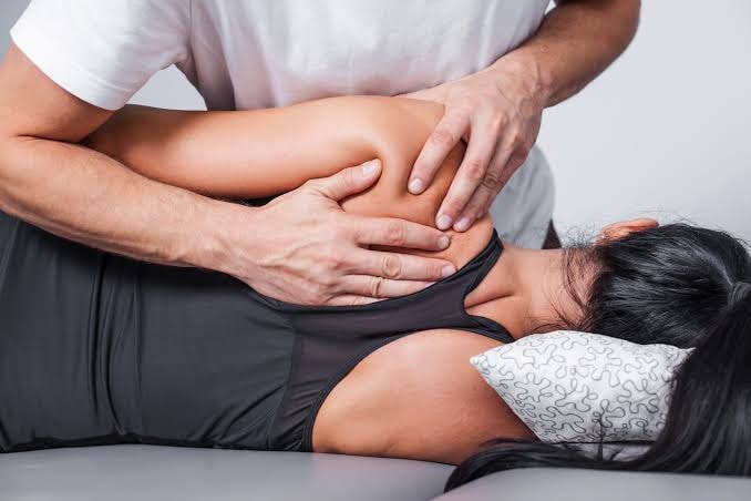 Soft tissue adjustment via guided breathing technique for spinal decompression